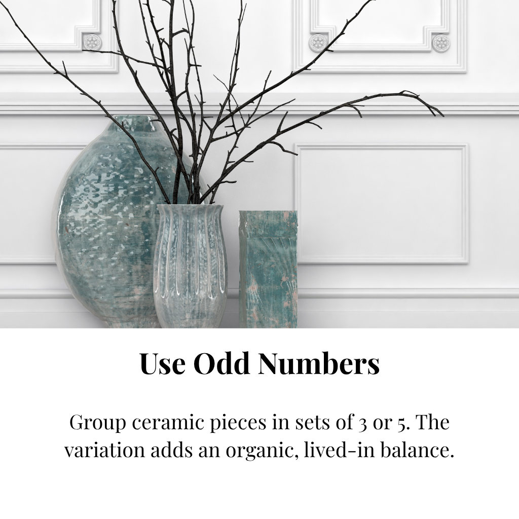 Blue-toned glazed ceramic vases with black decorative twigs.