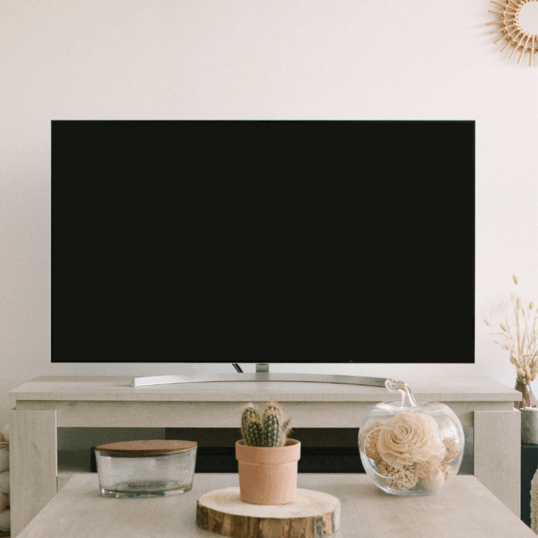 Neutral-toned TV console with modern tabletop decor