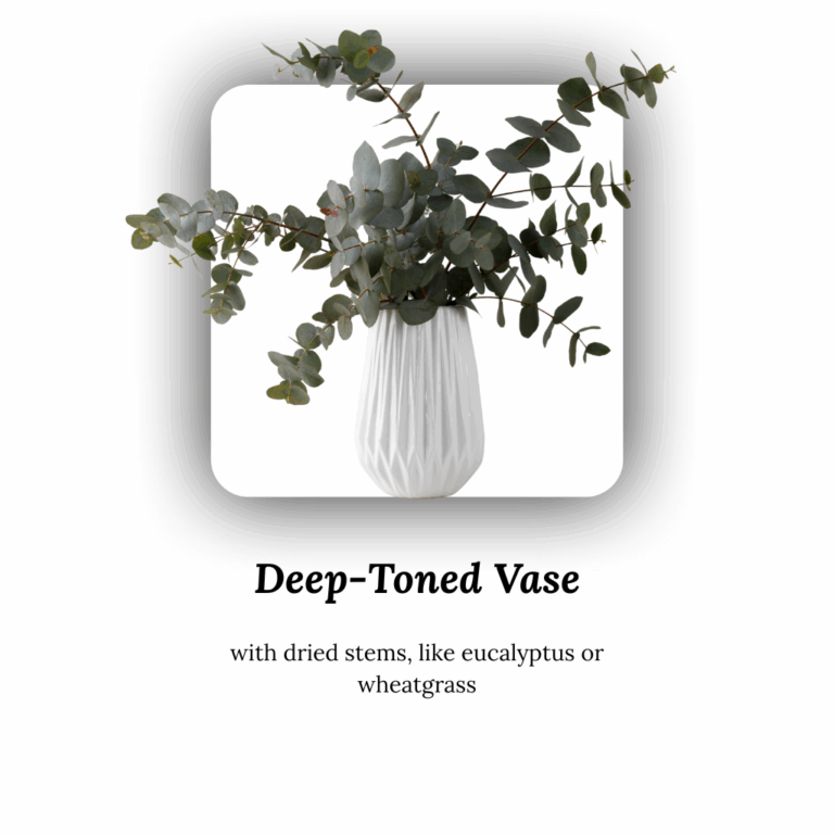 White deep-toned ceramic vase with dried eucalyptus stems.