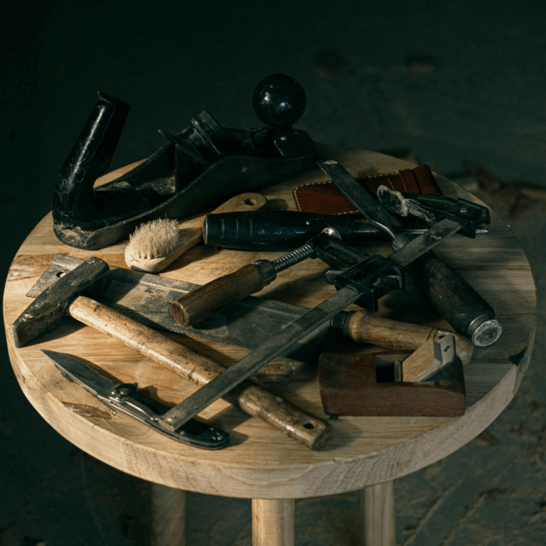 Assortment of vintage tools on wooden stool