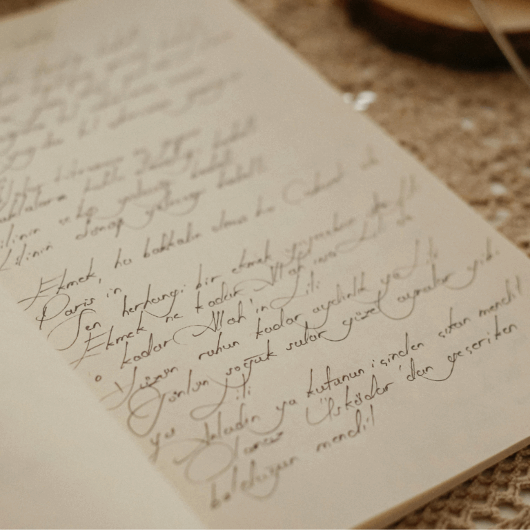 Open handwritten journal with elegant cursive writing