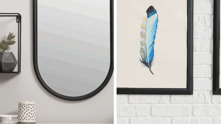 Minimalist entryway wall with arched mirror and framed feather artwork
