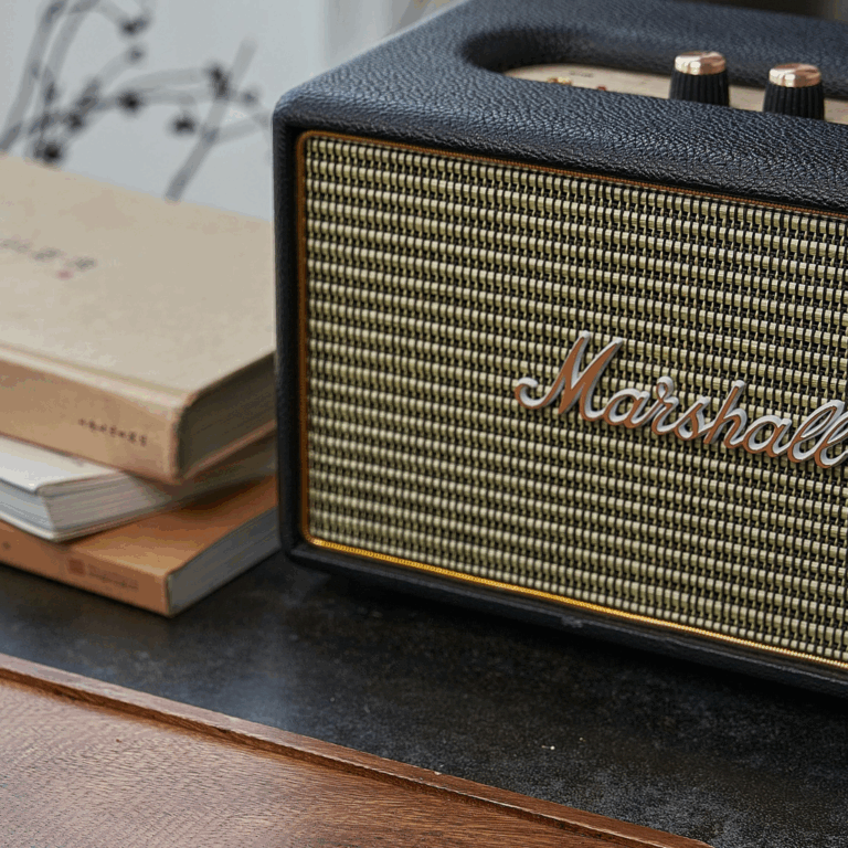 Vintage-style speaker with books and cozy modern aesthetic