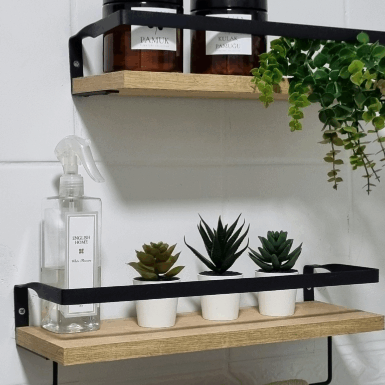 Wall-mounted wooden shelves with succulents in ceramic pots and home fragrance items