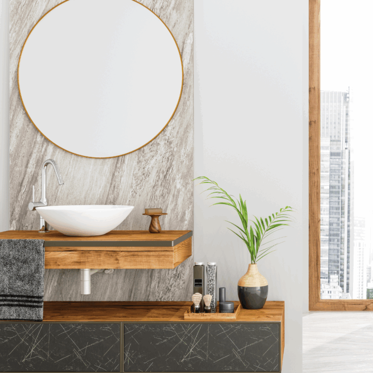 Minimalist bathroom vanity with a round mirror, vessel sink, wooden countertop, and a small potted palm, styled for a spa-inspired home retreat.
