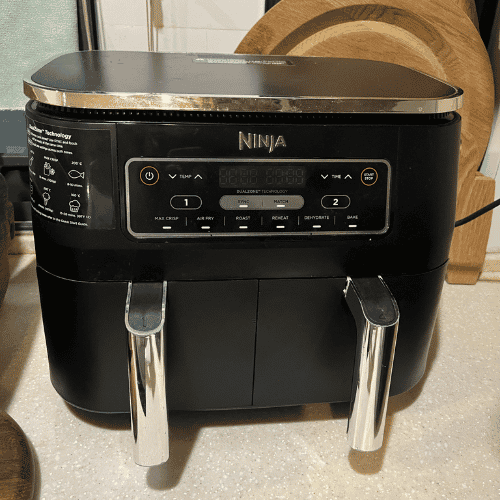 Close-up of the Ninja Foodi DualZone air fryer control panel with Match Cook and Smart Finish functions.